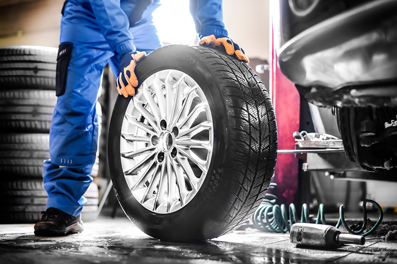 Mechanic Replacing Tires